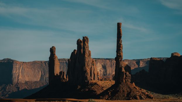 Majestic red rock formations under clear blue skies in the Arizona desert.