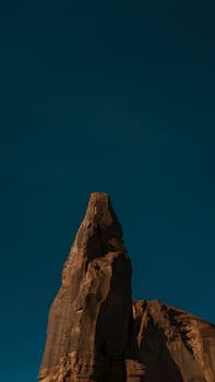 Stunning red rock formation in Arizona under a deep blue sky, ideal for nature lovers.