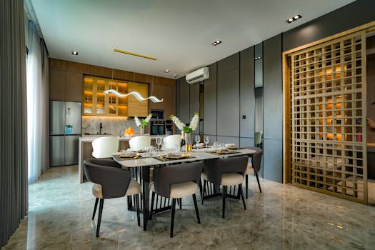 A stylish dining room setup in a modern apartment in Jakarta with contemporary lighting and furniture.