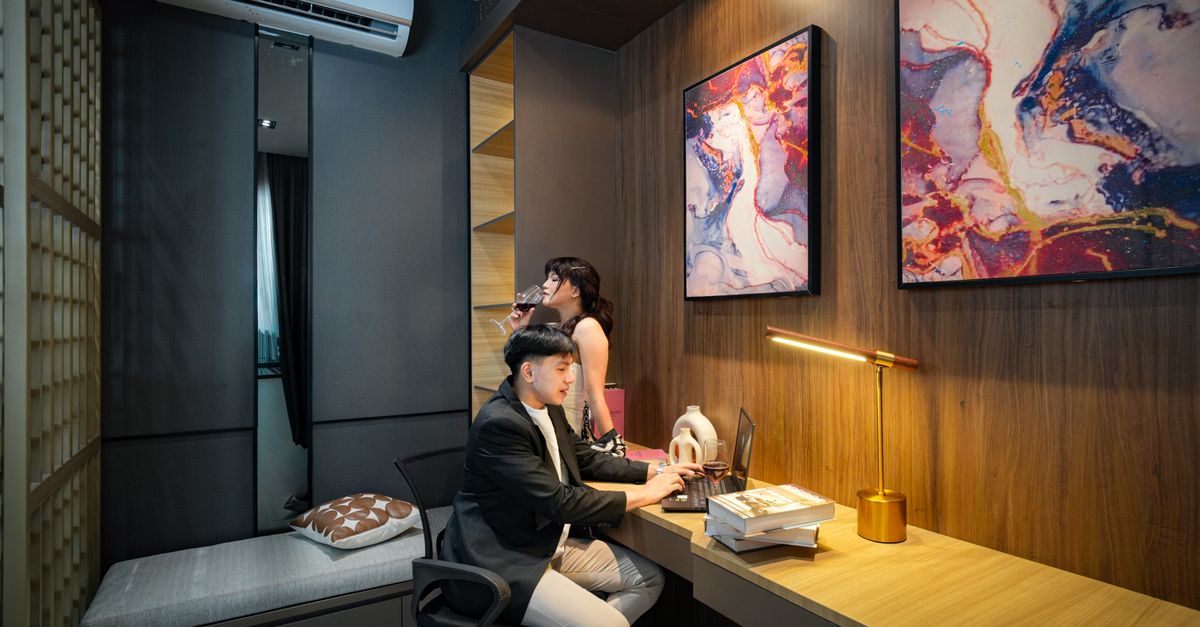 Contemporary workspace in Jakarta featuring abstract art and modern design elements.