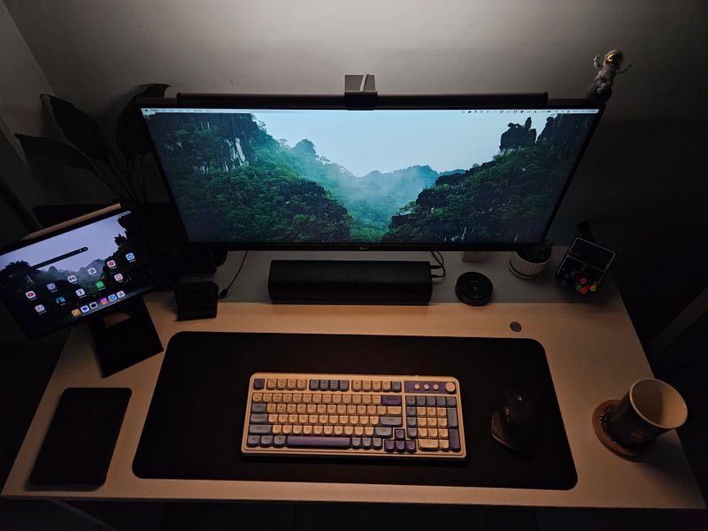 monitor raised on a stand with notebooks stored beneath it