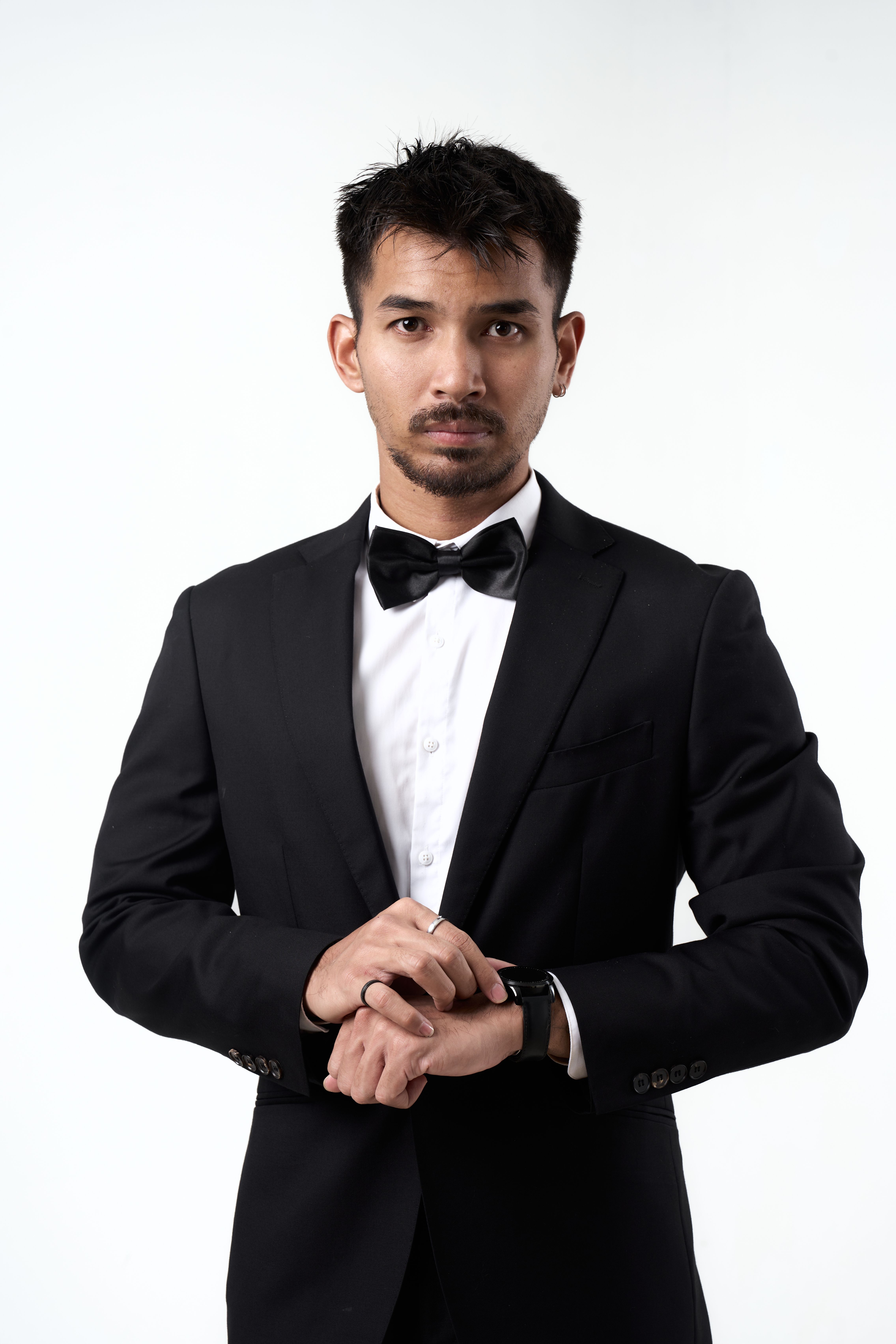 Elegant Portrait of Man in a Black Suit and Bow Tie · Free Stock Photo