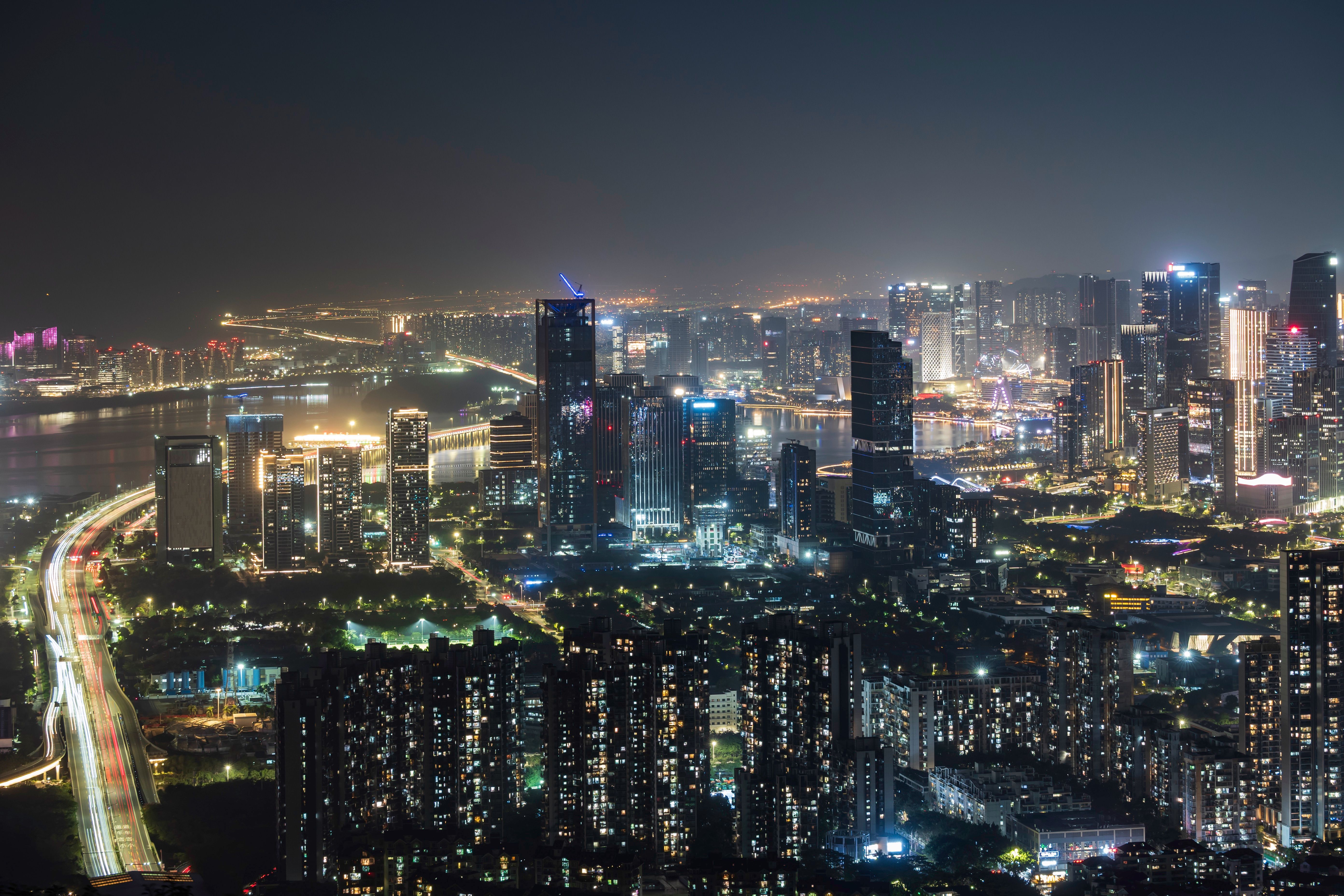 Vibrant Night Cityscape with Glowing Skyscrapers · Free Stock Photo