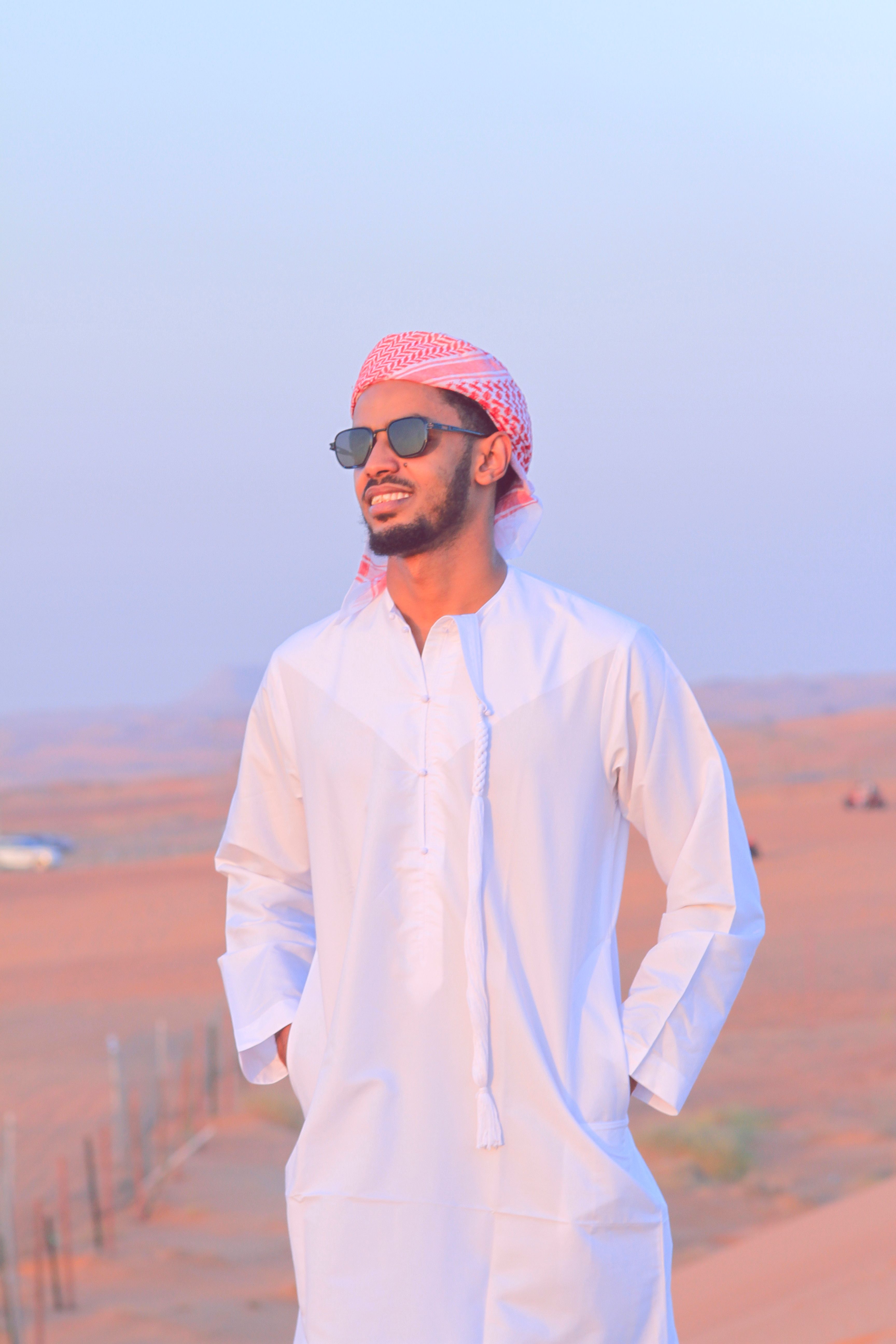 Young Man in Traditional Attire in Desert · Free Stock Photo