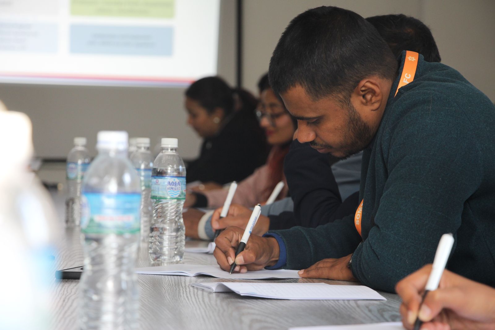 Students taking notes during a workshop session