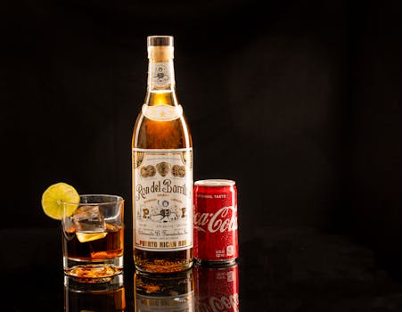 Rum and Coke with lime on black background, featuring Puerto Rican rum.