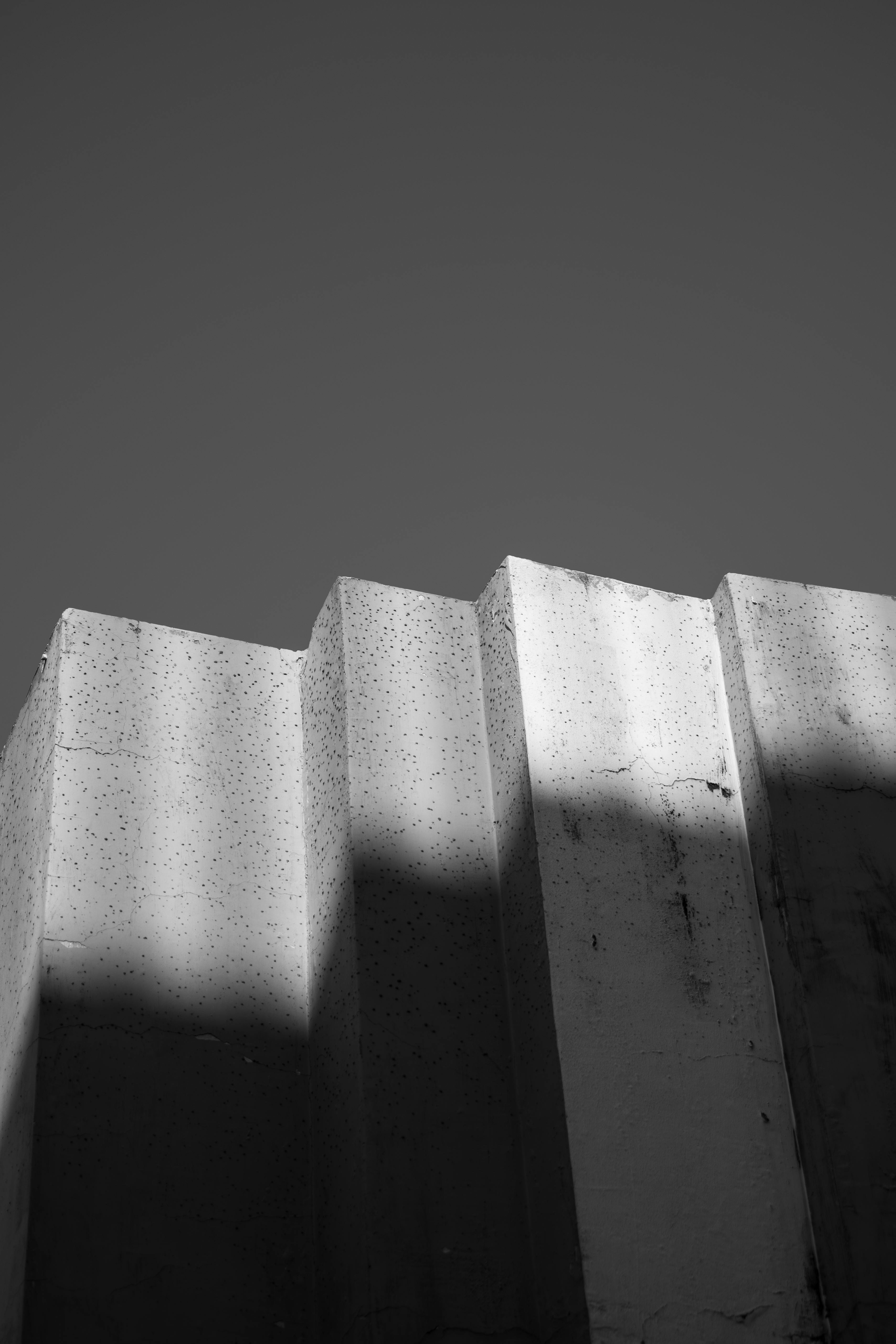 Free Black and white photo of geometric concrete structure with shadows. Stock Photo