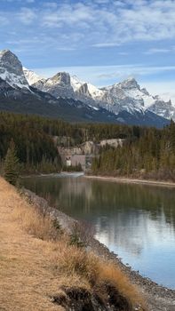 Breathtaking view of snowy mountains and river in Canmore, Canada.