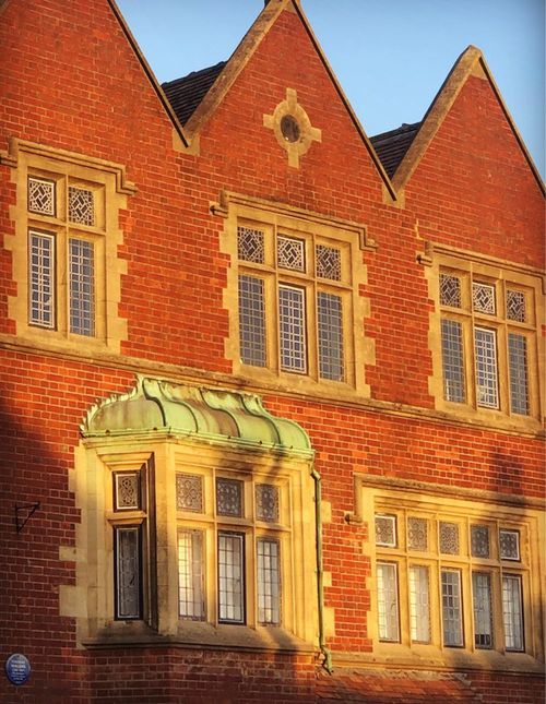 Free Beautiful red brick building facade illuminated by winter sunlight in West Sussex. Stock Photo