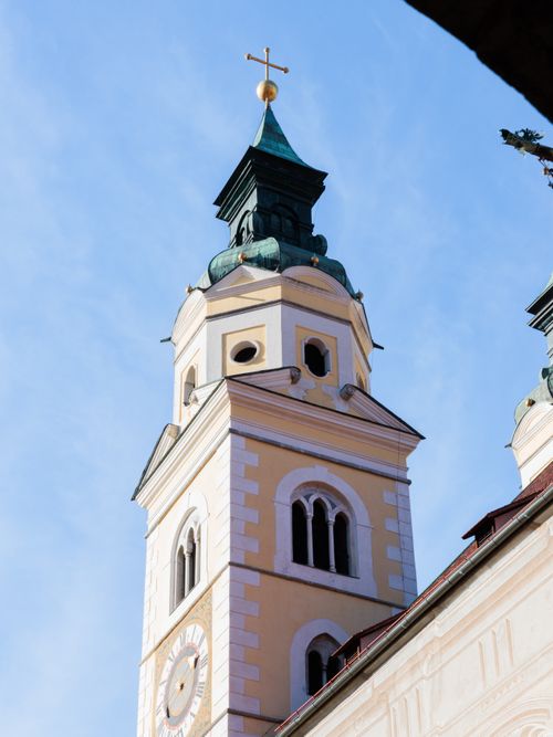 Free Captivating view of a historic church tower standing tall against a clear blue sky. Stock Photo
