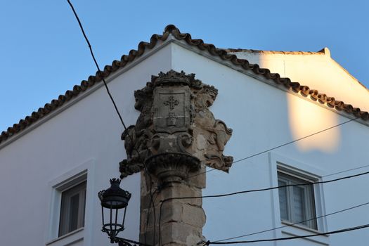 Close-up of historic stonework and heraldry on a building in El Puerto de Santa María.