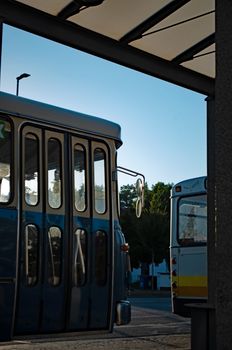 Retro blue bus parked at a station in Ingolstadt, Bavaria, captured during daylight, exhibiting a vintage appeal.