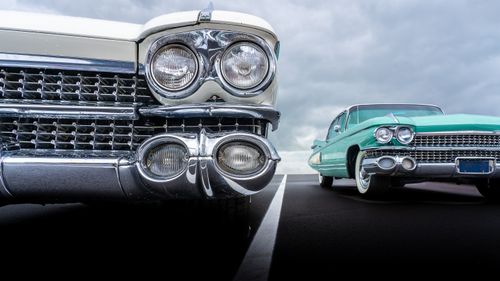 Free Close-up shot of vintage cars with chrome bumpers showcasing classic style and nostalgia. Stock Photo