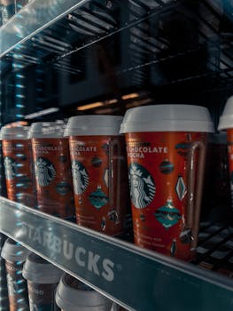 Colorful Starbucks chocolate mocha cups on a store shelf.