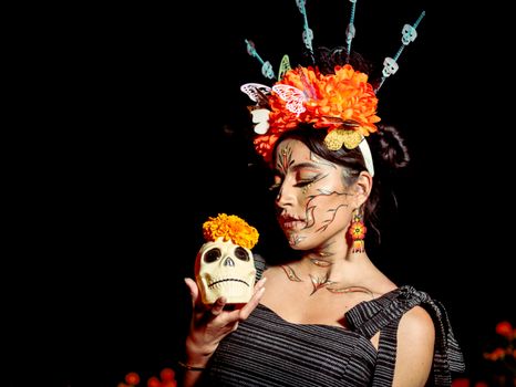 Elegant Day of the Dead makeup and attire featuring floral skull artistry and festive accessories.