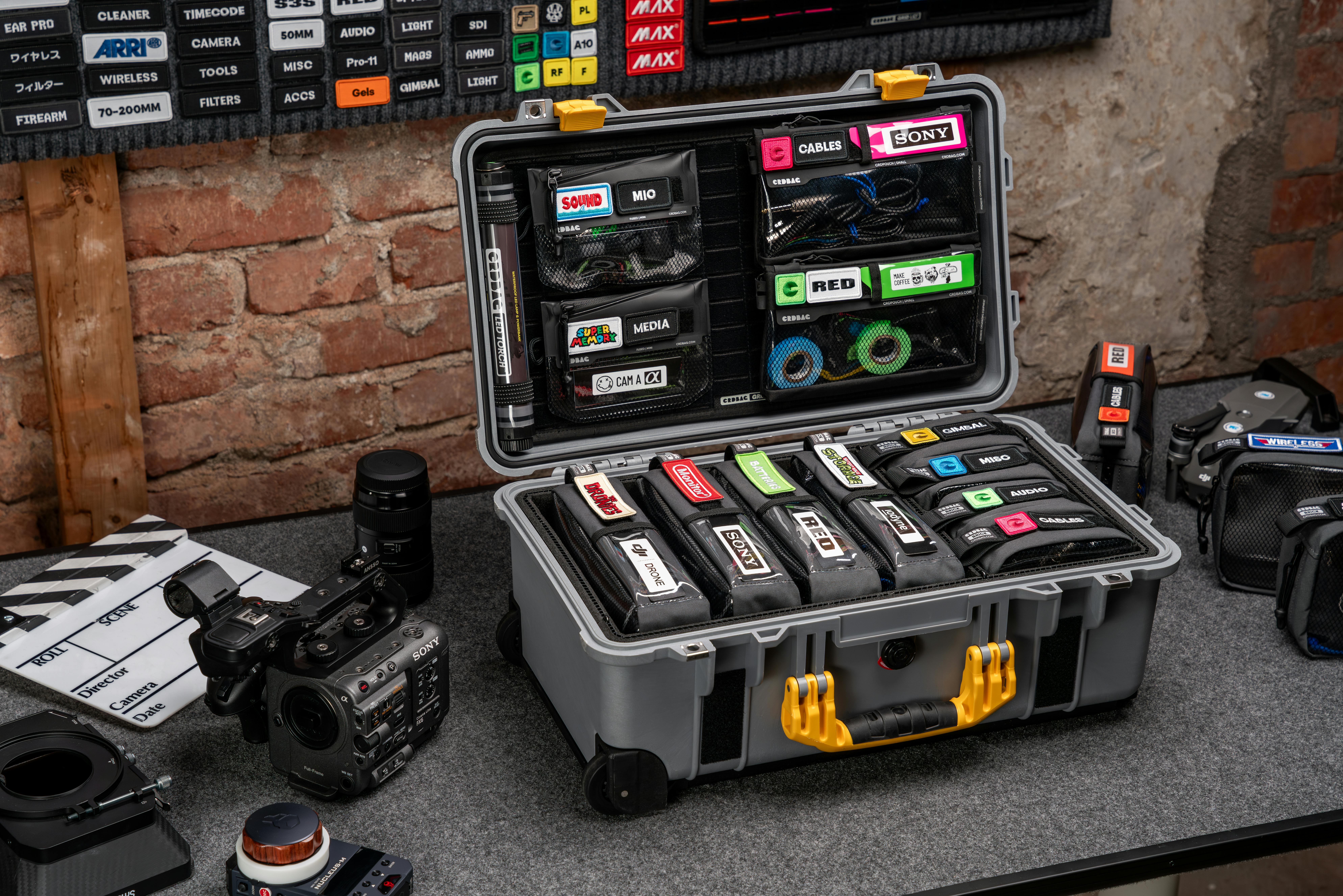 Neatly organized video production gear and camera setup on a table.