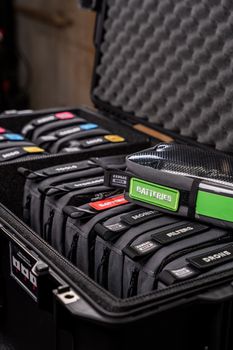Neatly arranged camera accessories and equipment in a protective hard case for travel.