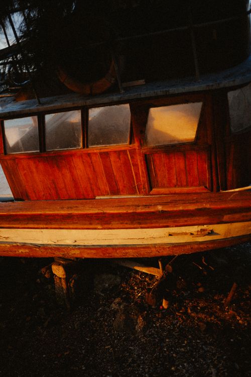 Free A rustic wooden boat illuminated by sunset hues in Istanbul, reflecting a vintage mood. Stock Photo