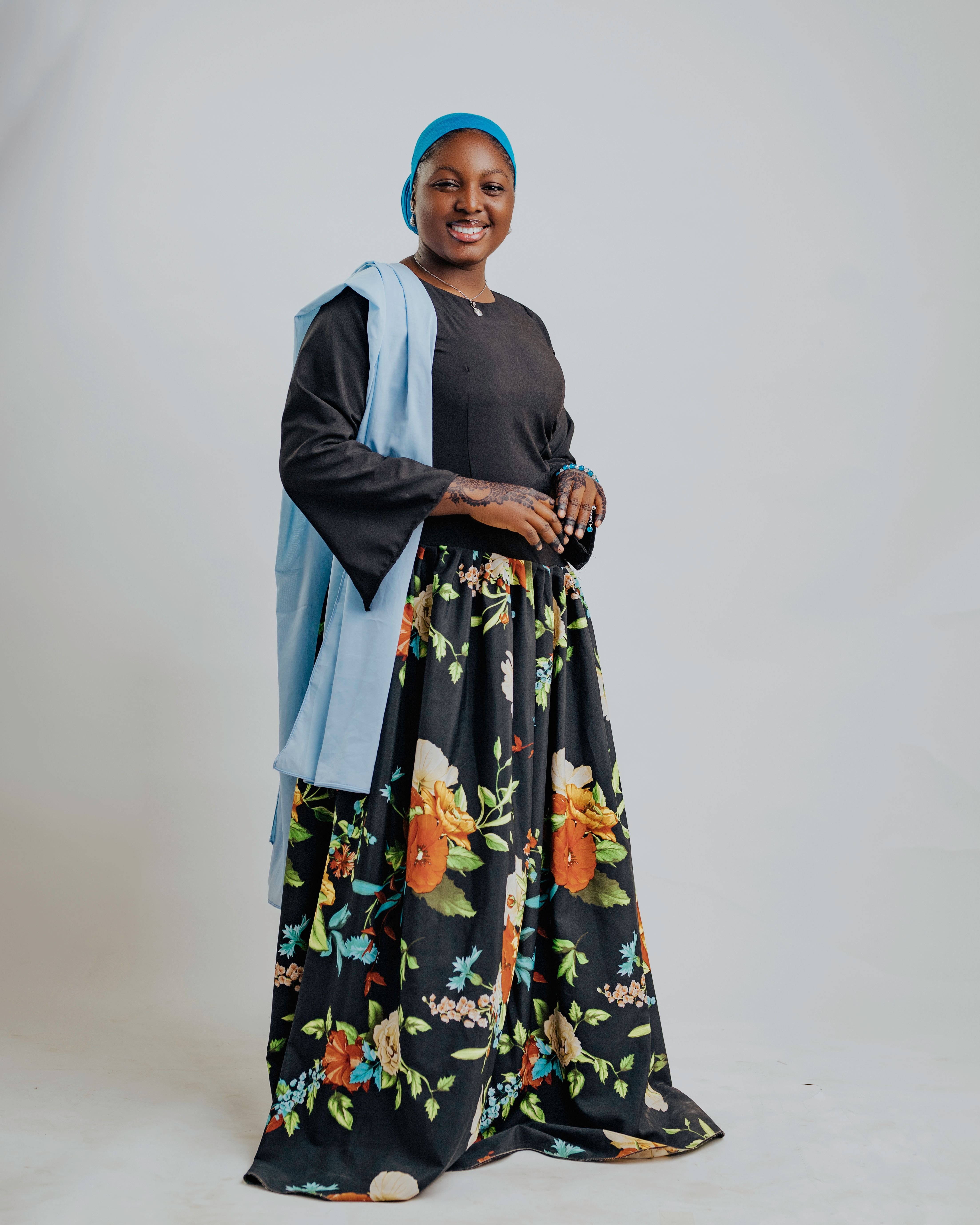 Elegant Portrait of a Woman in Floral Skirt · Free Stock Photo