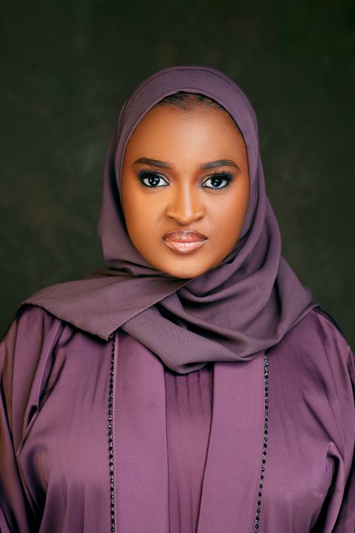 Elegant Portrait of Woman in Purple Hijab · Free Stock Photo
