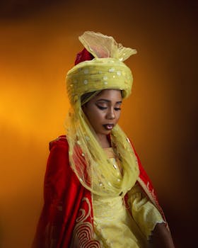 Beautiful woman in vibrant traditional dress with expressive lighting on warm background.