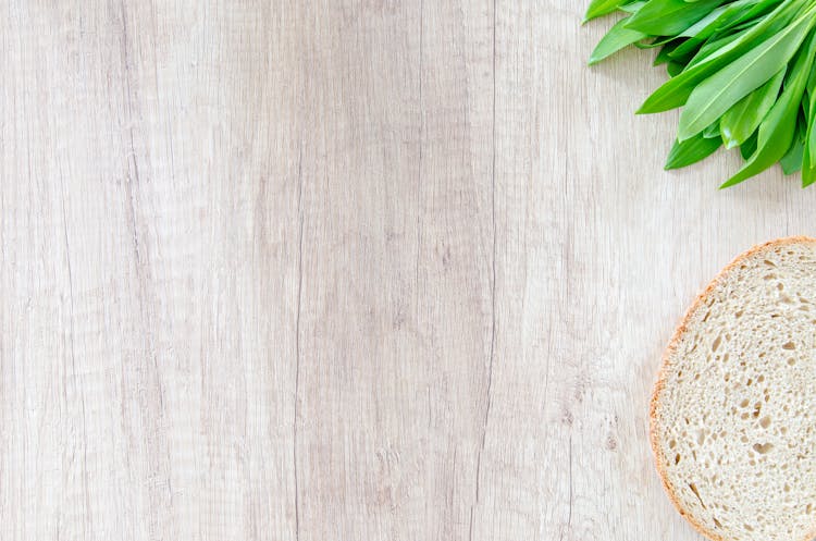 Sliced Bread On Brown Wooden Board