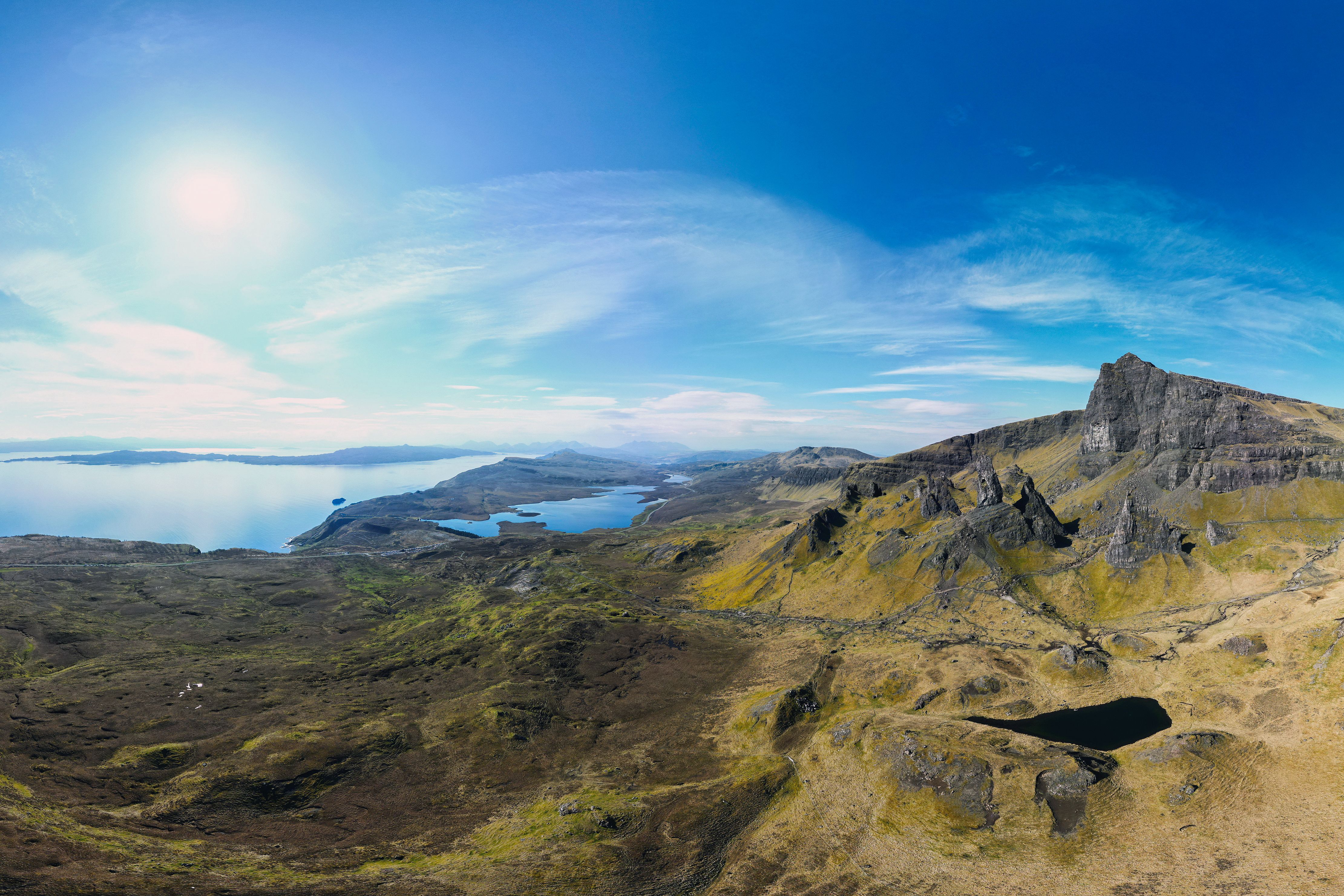 Dramatic coastal cliffs and turquoise waters of Isle of Skye