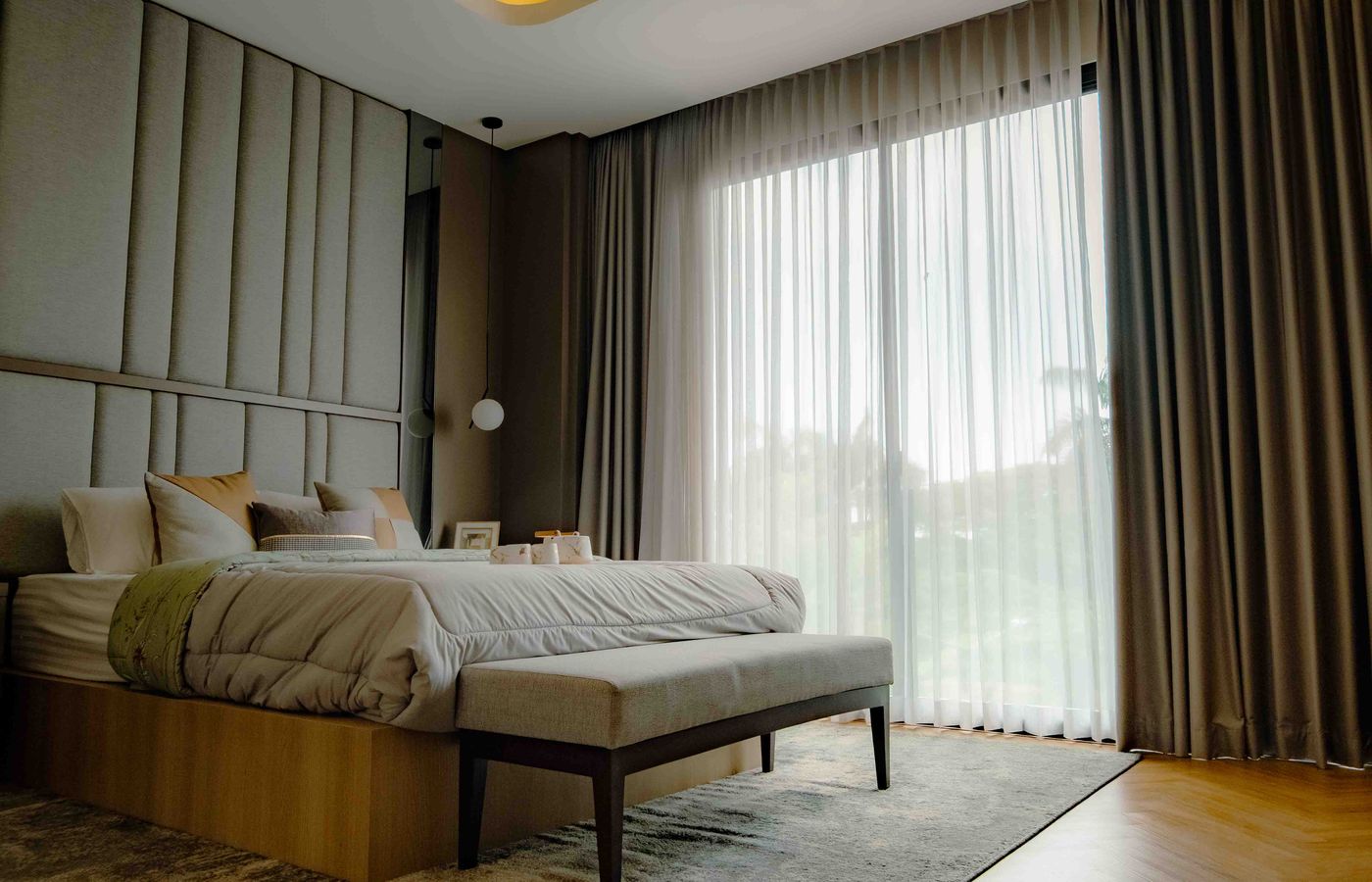 Contemporary bedroom in Jakarta with elegant design and abundant natural light.