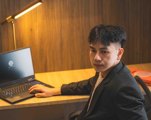 Free A young businessman working on a laptop in a stylish office setting, Jakarta. Stock Photo