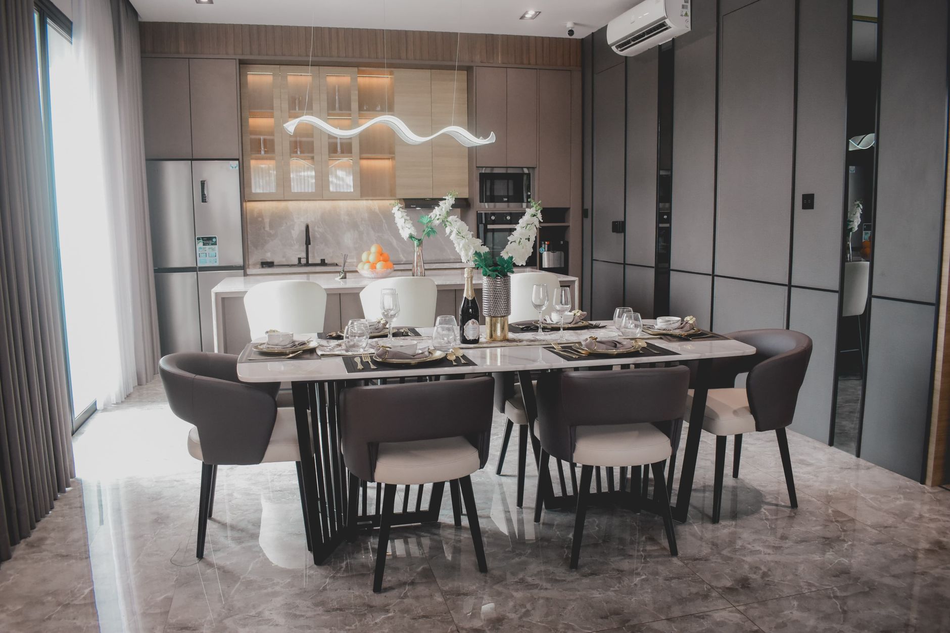 Stylish modern dining room setting in a luxury Jakarta home.