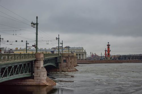 Free Scenic view of a bridge and iconic Rostral Columns in winter, St. Petersburg. Stock Photo