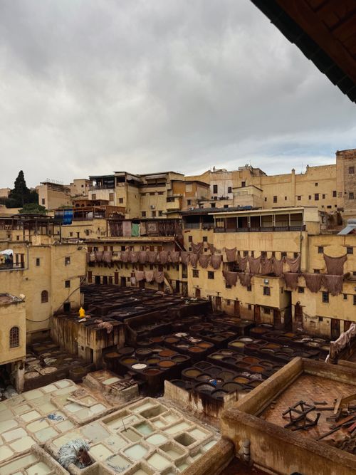 Free A vibrant view of the traditional tanneries in Fès, Morocco showcasing ancient leather dyeing techniques. Stock Photo