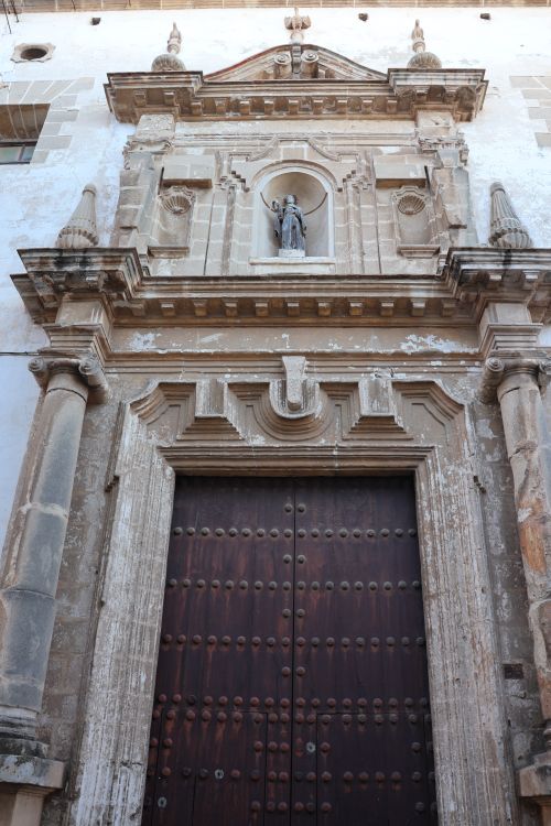 Free Intricate architectural details of a historic church facade in El Puerto de Santa María, Spain. Stock Photo