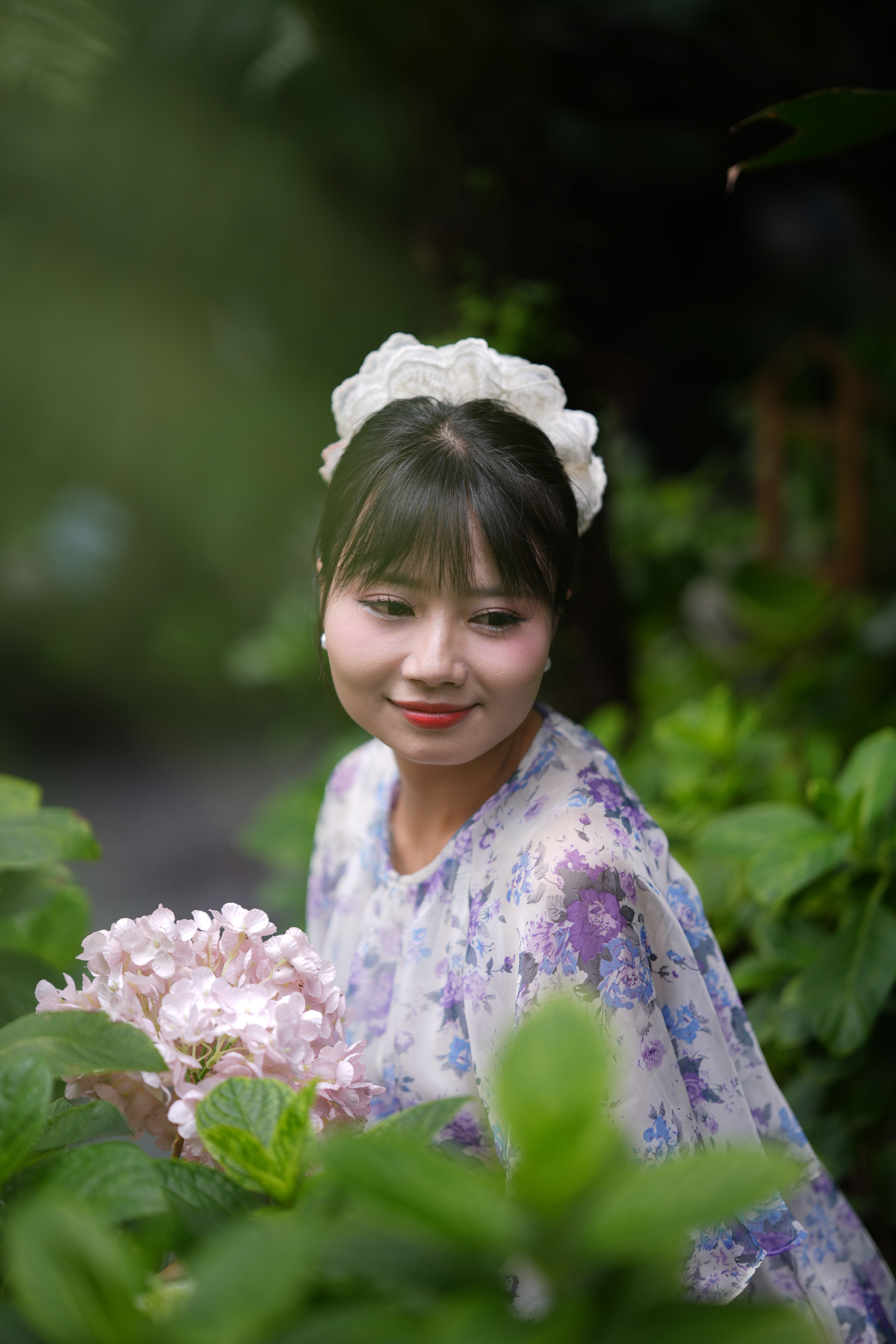 Woman in Floral Dress with Pink Hydrangeas Outdoors · Free Stock Photo