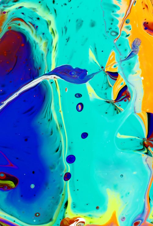 Free Colorful abstract fluid art with swirling patterns and bright blue, yellow, and teal hues. Stock Photo