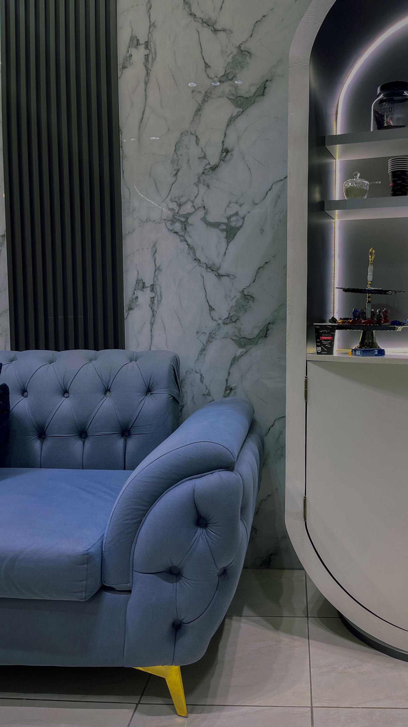 Elegant modern living room with deep blue seating