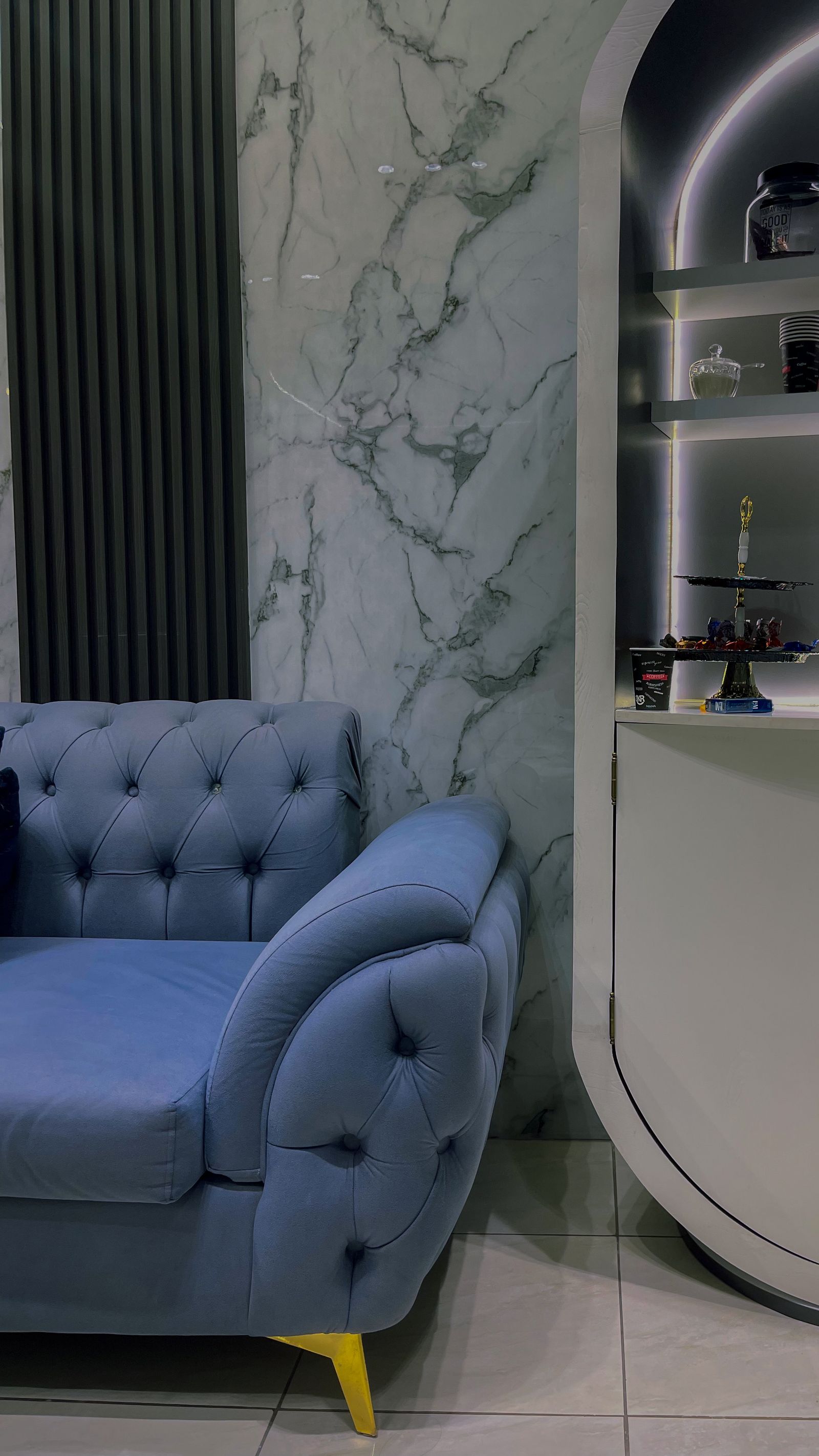 Elegant modern living room with deep blue seating