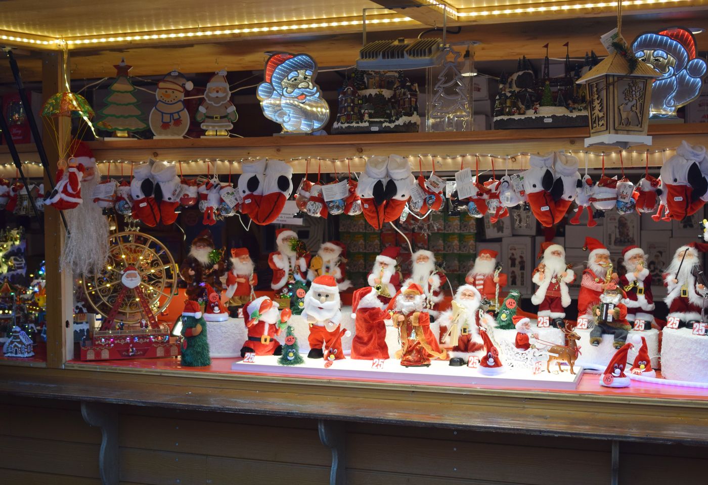 A Strasbourg Christmas market stall full of Santa Claus figures and festive decorations