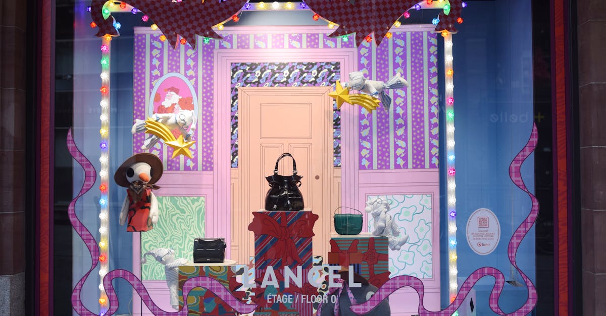 Photo by Alexis B Colorful storefront display with lights in Strasbourg, France, showcasing bags and decorative items.