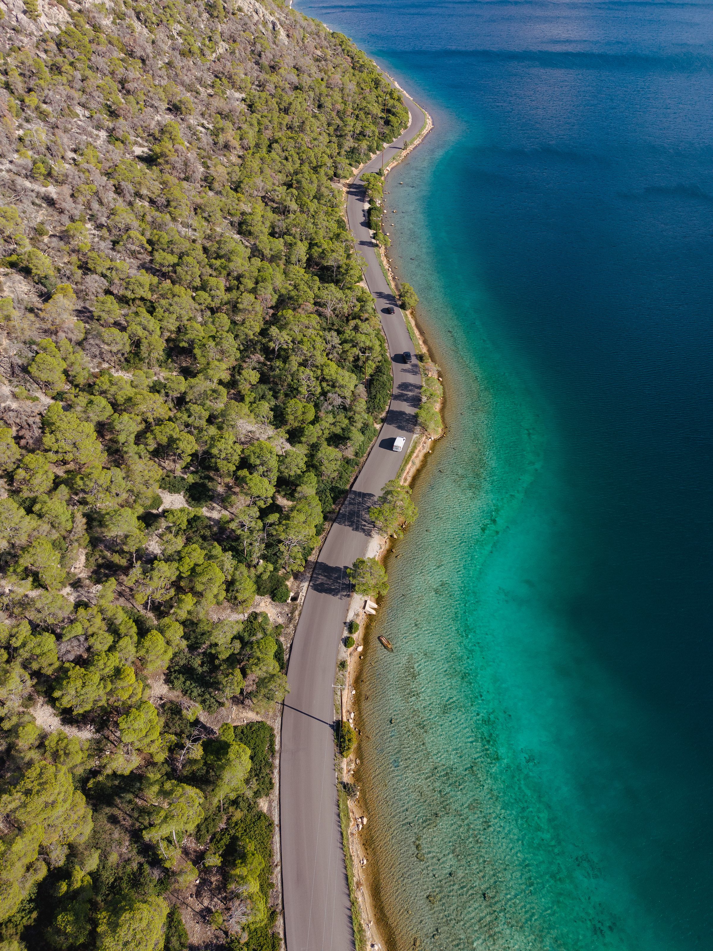 Crystal-clear sea and coastal road in Vouliagmeni on the Athens Riviera