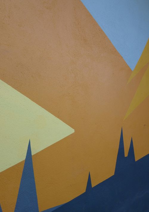 Free Vibrant abstract mural with geometric shapes and bold colors on a wall. Stock Photo