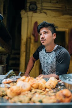 Street vendor in Varanasi selling traditional Indian snacks.