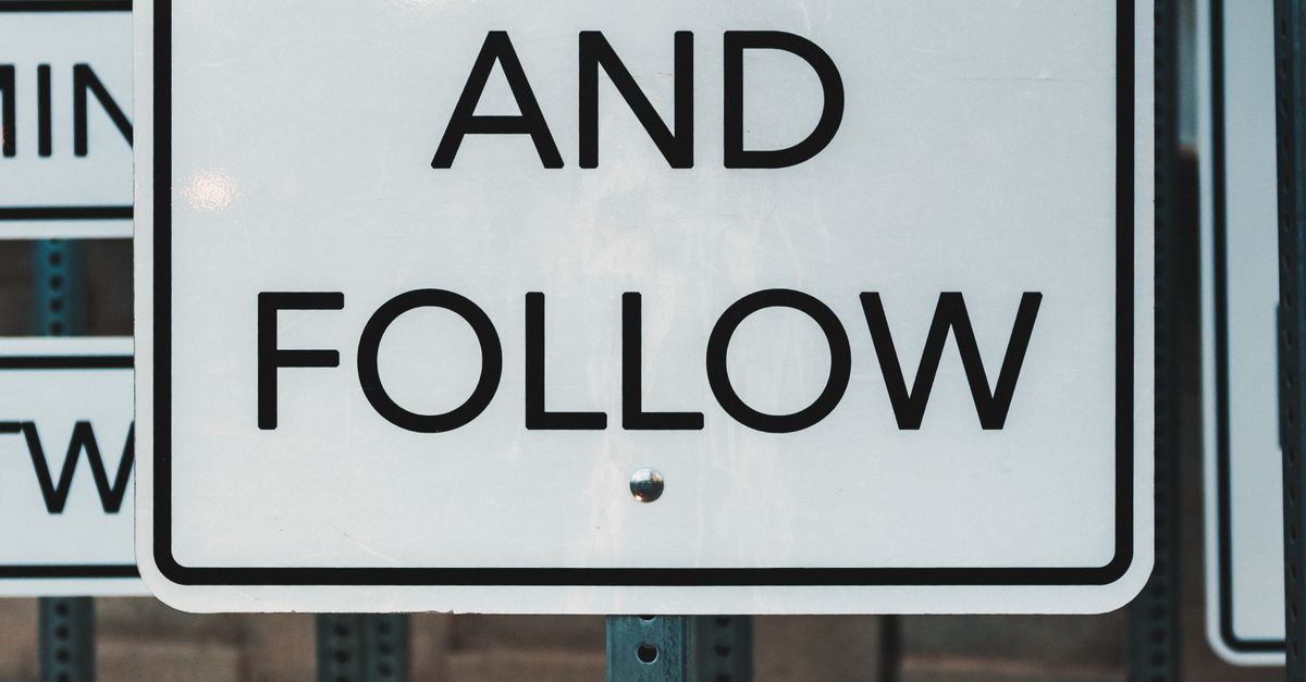 Follow Signs Line Urban Signage with 'Lead and Follow' Message · Free Stock Photo