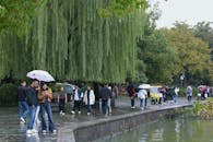 People Strolling Along West Lake in Hangzhou