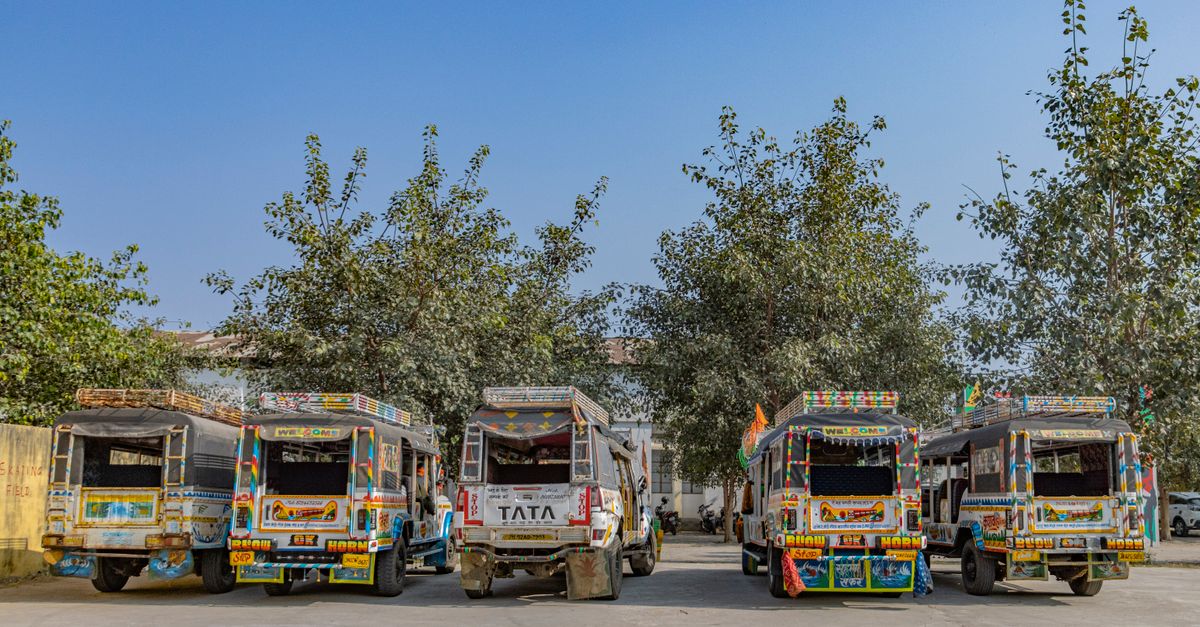 Brightly colored shared taxis parked in Hazaribagh, showcasing Indian vehicle art.