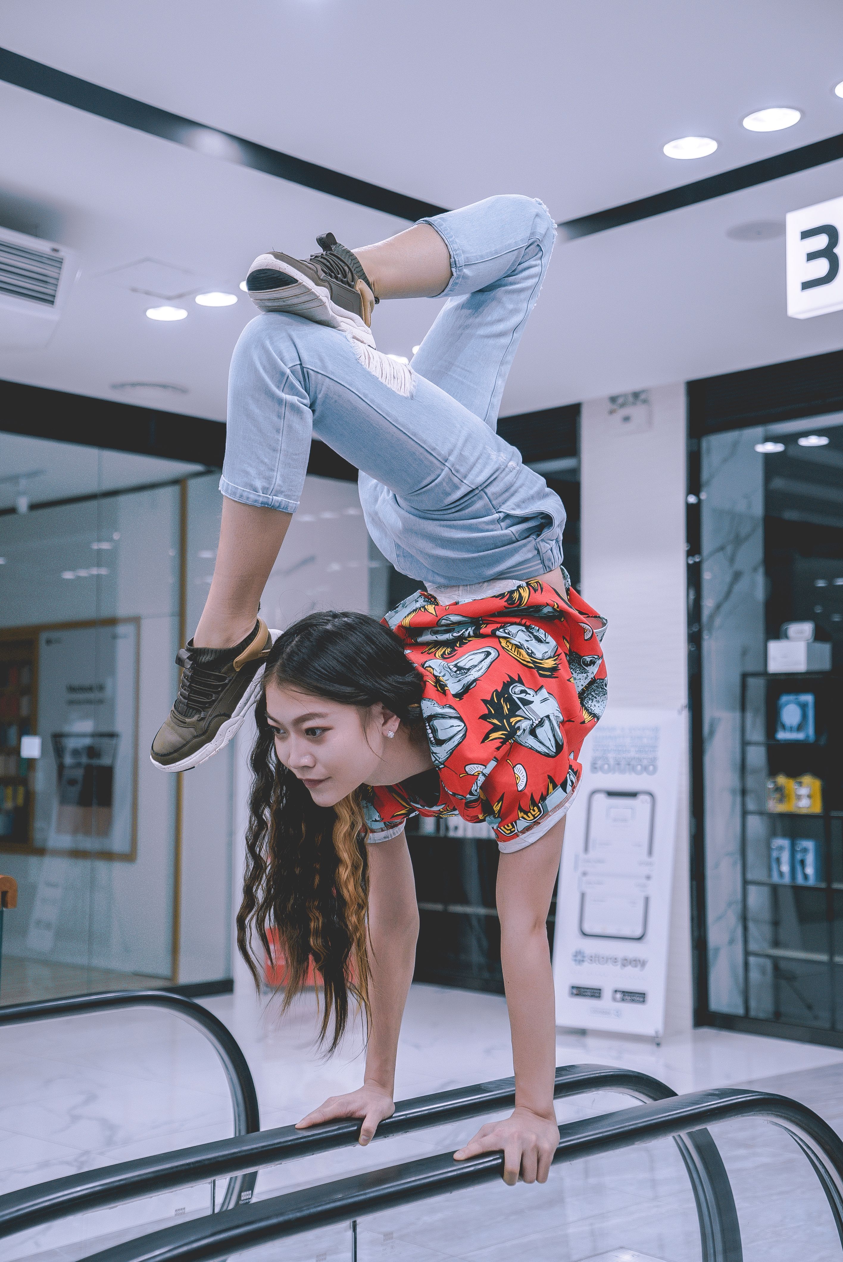 Woman Making Hand Stand on Handrails · Free Stock Photo