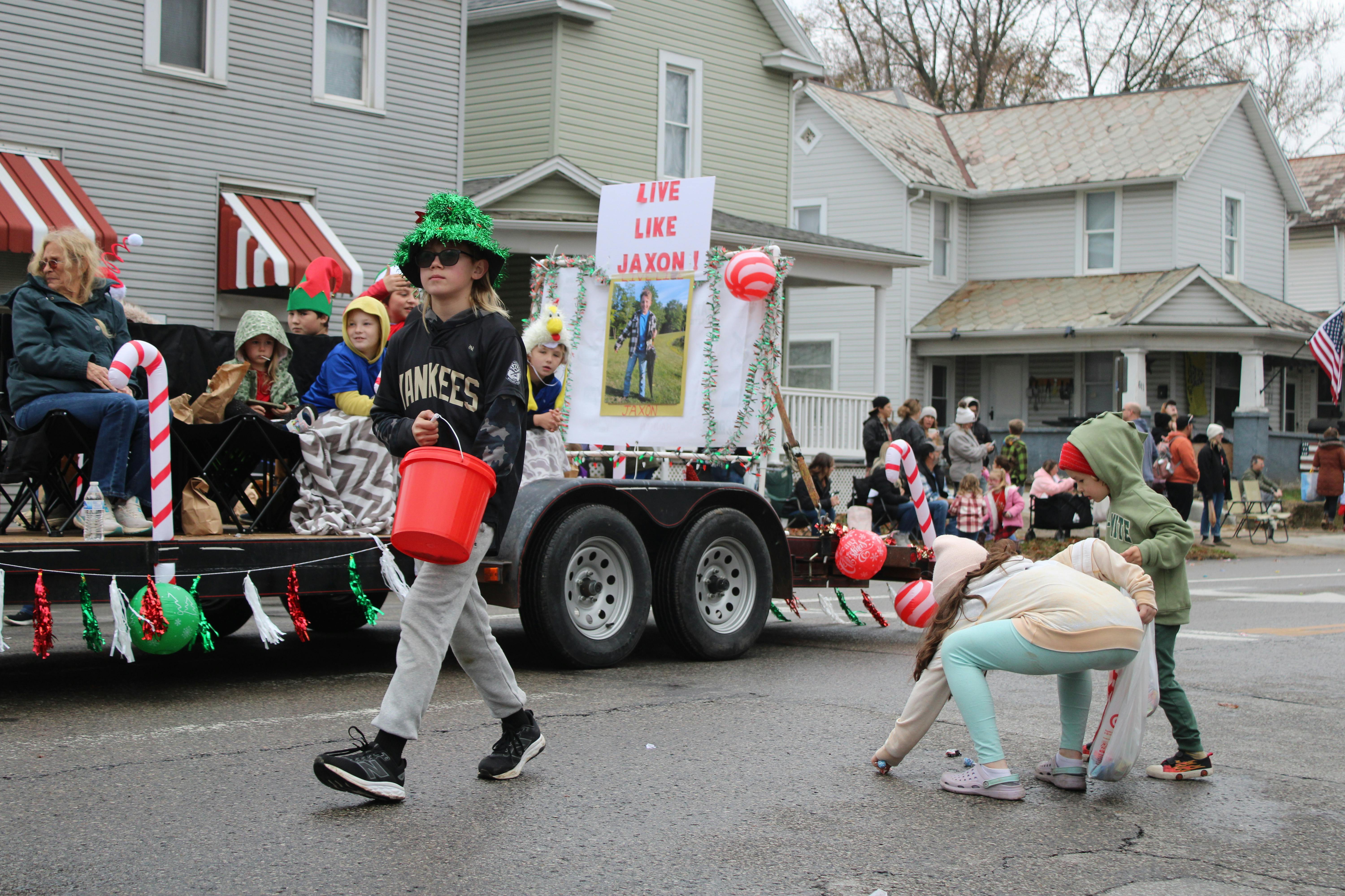 An empty, pristine infinity pool at a modern luxury home, overlooking a hazy city skyline at dusk.