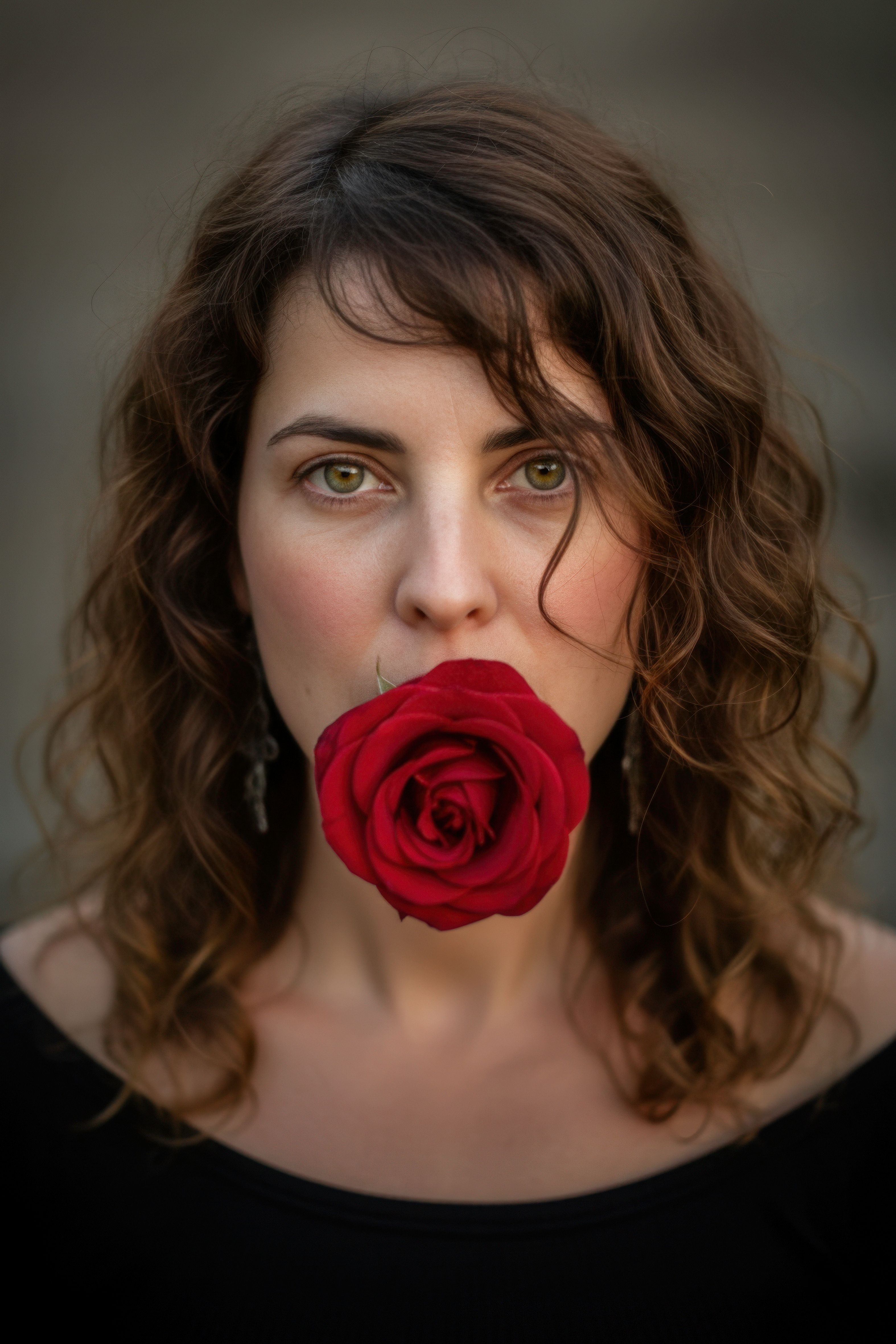 Woman Holding Red Rose in Artistic Portrait · Free Stock Photo