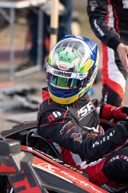 Bitmap Racing Driver Kart Racing Driver in Action with Colorful Helmet · Free Stock Photo