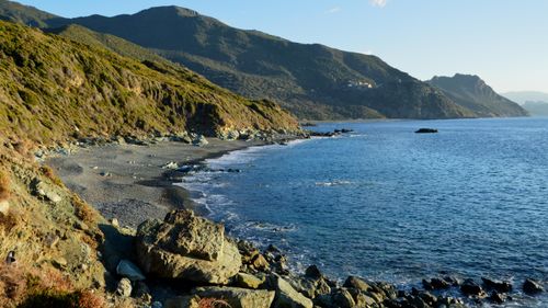 Free Stunning view of the rocky coastline and serene waters in Ogliastro, Corsica, France. Stock Photo